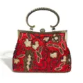Red beaded sequin evening bag detail featuring floral embroidery and antique bronze handle. - Burgundy