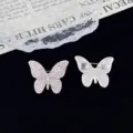 Exquisite rhinestone butterfly brooch detail showing front sparkle and back pin lock mechanism. - Butterfly Style (R78) / Gold