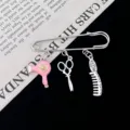 Close-up of hair salon themed brooch featuring cute mini hairdryer scissors and comb charms. - Pink Hairdryer Style (R725)