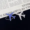Close-up detail view of the creative airplane shaped rhinestone brooch with blue crystals and pin. - Dark Blue Rhinestone Style (R205)