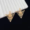 Gold vintage filigree hollow collar clip detail shot showcasing intricate metal floral design. - 2 Pieces/Pack (Pair) / Gold