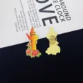 Detailed view of Chinese Huabiao pillar and peony enamel pin, showing front and back clasp. - Huabiao and Peony Style (R410)