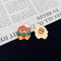 Close up detail of cute cartoon burger enamel pin showing front and secure back clasp. - Hamburger Style (R781)