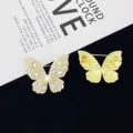 Rhinestone butterfly brooch detail view, showing sparkling crystals and pin mechanism. - Gold Style (R760)