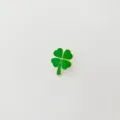 Green enamel four-leaf clover brooch with gold trim, stylish and trendy fashion accessory detail. - R98