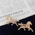 Detailed view of gold 2026 zodiac horse brooch, elegant rhinestone fashion pin accessory. - Gold