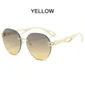 Luxuriöse rahmenlose Sonnenbrille mit gelben Farbverlaufslinsen und goldenen Metalldetails. - Grau-teefarbene Linsen