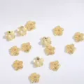 Close-up of gold flower spacer beads, hollow alloy charms for DIY jewelry making and crafts. - 6mm / Gold 4