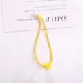 Elastico per capelli giallo con perla bianca e anello giallo per acconciature quotidiane bambini. - 1 Pezzo / Giallo