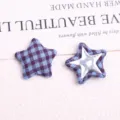 Detailed view of retro fabric plaid five-pointed star buttons, perfect for DIY coat accessories. - Dark Blue