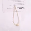 Elastico per capelli beige minimalista con perline, fermacoda elastico per dettagli quotidiani. - 1 Pezzo/Confezione / Bianco avorio