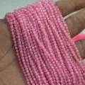 Gros plan de fils de perles en pierres précieuses facettées roses pour bijoux DIY - 4mm (Environ 100 Pcs / 16g) / Rose