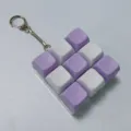 Detailed close-up of a purple and white 3x3 mechanical keyboard keycap fidget keychain. - With Lights / Macaron 9-Key (White Purple Two-Tone)