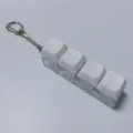 Porte-clés fidget toy à 4 touches mécaniques avec capuchons blancs pour anti-stress. - Macaron 4 touches (Blanc Lait)