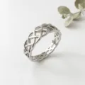 Silver Celtic knot ring for women, intricate woven hollow design, elegant vintage finger jewelry. - US Size 6