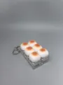 Niedlicher Karamellbrot Fidget Schlüsselanhänger mit mechanischen Tasten für Stress. - Doppelreihiger 6-Knopf Brot Stil