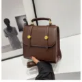 Brown PU leather backpack for women, stylish small daypack with top handle and golden hardware. - 20x9x20cm / Coffee