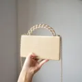 Minimalist crocodile pattern box bag with chunky gold chain handle and chic crossbody strap. - Champagne