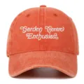 Detailed view of a retro washed embroidered baseball cap featuring Garden Centre Enthusiast text. - One Size / Orange