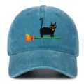Detailed view of the vintage washed blue baseball cap featuring cute black cat embroidery. - One Size / Lake Blue