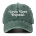 Close-up detail of the vintage washed green baseball cap featuring neat white embroidery text. - One Size / Grass Green