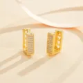 Detailed shot of fashionable geometric paved cubic zirconia huggie earrings in polished gold tone. - Geometric Rectangular Ear Hoop (EH1306)