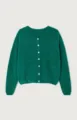 Green knit cardigan detail showing V-neckline and white button closure, soft sweater texture. - Malachite green