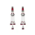 Detailed view of ethnic silver dangling earrings with red gems, chains, and jhumka bell charms. - Red