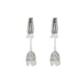 Detailed close-up view of vintage silver rhinestone jhumka earrings with pearl tassels. - White