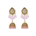 Close-up detail of antique gold drop earrings with pink beads and sparkling crystal stones. - Pink