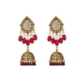 Close-up detail of vintage gold-plated ethnic jhumka earrings with red beads and crystals. - Red
