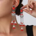 Exquisite exotic red stone long earrings with silver carved details and bell tassels. - Fan Carved Tassel Bell Style (S5121-7)