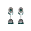 Close-up of vintage silver jhumka earrings with green beads and center stone, boho ethnic style. - Dark Green