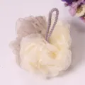 Two-tone mesh bath sponge with hanging loop for daily body cleaning and shower use. - Beige and Coffee Two-Tone Bath Ball