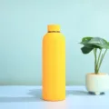 Stainless steel vacuum insulated water bottle in vibrant yellow matte finish, 500ml portable. - Yellow