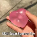 Dettaglio giocattolo antistress a forma di cuore che cambia colore, morbido e malleabile. - Taglia S / Rosa Cangiante