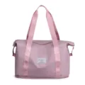 Detailed travel duffel bag with pink webbed straps, fashion label patch, and expansion base. - Cherry Pink (Random Logo)