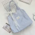 Light blue striped star canvas tote bag with elegant white lace bow for casual daily use. - Light Blue With White Flower Bow