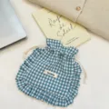 Detailed view of blue and white plaid drawstring pouch with cute ruffle trim design. - Gray Green Plaid