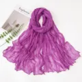 Detailed view of the crinkled purple scarf texture, showing soft lightweight fabric and elegant folds. - 180x90cm / Deep purple