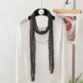 Detailed shot of dark grey crinkled long scarf styled with a white top, elegant daily wear accessory. - 180x20cm / Dark Gray