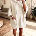 Oversized hooded half-sleeve sweatshirt dress in solid beige, featuring dual front pockets. - S / Dresses / White