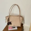 Detail view of minimalist suede tote bag, large capacity casual shoulder bag with elephant charm. - With Charm / Khaki