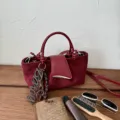 Retro niche textured suede handbag, stylish shoulder crossbody bag for women daily detail view. - No Pendant / Red