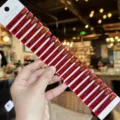 Close-up of red transparent acrylic duckbill hair clips set on display card, fringe side clip. - 20 Pieces/Pack / Red