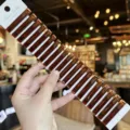 Close-up detail of acrylic hair clips in rich brown tortoiseshell color on a display card. - 20 Pieces/Pack / Coffee