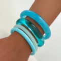 Set of four stylish blue translucent resin bangles, glossy curved finish fashion jewelry. - Blue 4-Piece Set