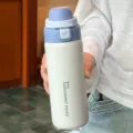 Stainless steel dual-drinking insulated thermos water bottle with portable lid design. - 500ml / White
