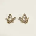 Gold geometric V-shaped stud earrings with sparkling zircon crystals and delicate pearls. - Geometric V-shape / Pentagram