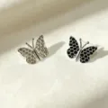 Asymmetric honeycomb butterfly stud earrings silver and black metal fashion jewelry variant. - Stud Earrings / Silver